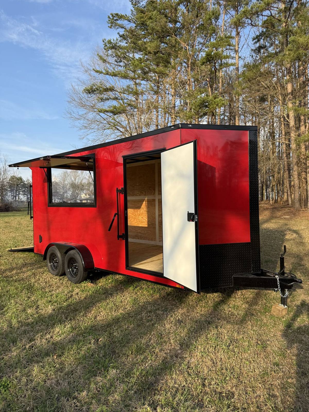 Red Triple R custom concession trailer with the serving windows open