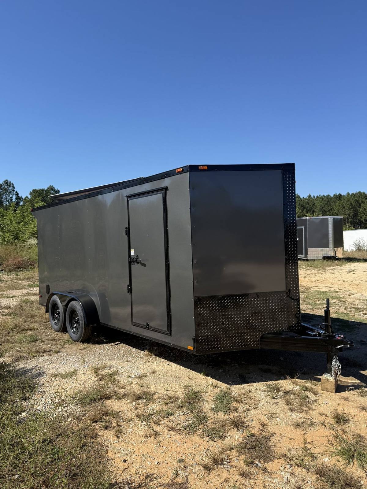 Charcoal Triple R enclosed cargo trailer with the Black Out package