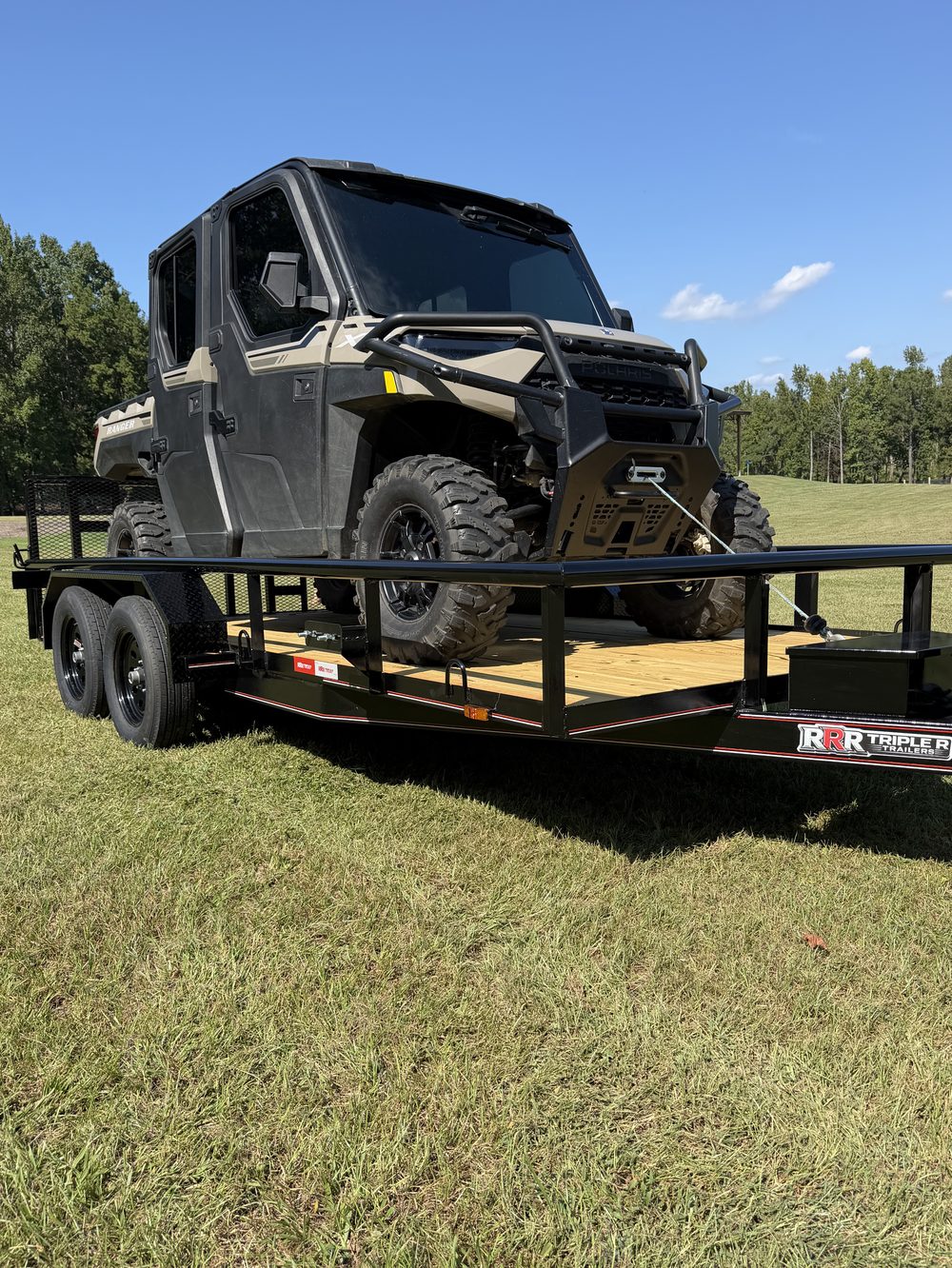 Polaris Ranger crew UTV loaded on a black Triple R tandem axle utility trailer