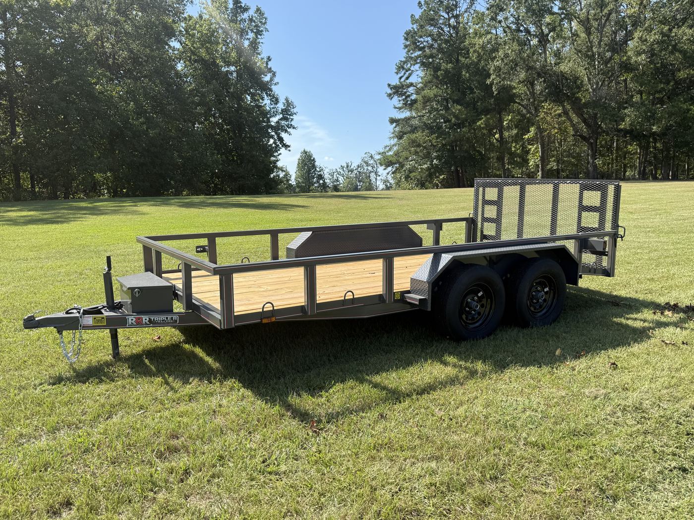 Charcoal Triple R tandem axle utility trailer with stand up ramps